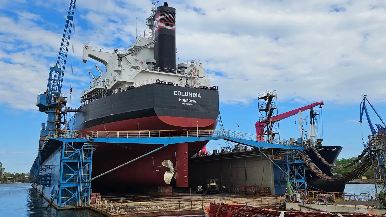 Marine superintendent inspecting vessel equipment during shipyard repairs